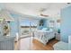 Bright bedroom with water views, ceiling fan, and comfortable bed at 143 94Th Ave # 2, Treasure Island, FL 33706