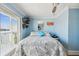 Bright bedroom with water views, ceiling fan, and comfortable bed at 143 94Th Ave # 2, Treasure Island, FL 33706