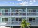 Two-story building with balconies, offering water views at 143 94Th Ave # 2, Treasure Island, FL 33706