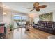Spacious living room with hardwood floors and large windows at 143 94Th Ave # 2, Treasure Island, FL 33706