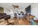 Bright living room with hardwood floors, large TV, and comfortable seating at 143 94Th Ave # 2, Treasure Island, FL 33706
