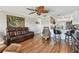 Open living room with hardwood floors and kitchen bar at 143 94Th Ave # 2, Treasure Island, FL 33706