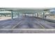 Covered parking area under the building with paved surface at 143 94Th Ave # 2, Treasure Island, FL 33706