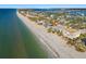 Wide aerial view of beachfront property and surrounding neighborhood at 1510 Gulf Blvd # 105, Indian Rocks Beach, FL 33785