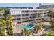 Complex pool with surrounding patio furniture at 1510 Gulf Blvd # 105, Indian Rocks Beach, FL 33785