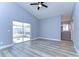 Spacious bedroom with wood-look floors and sliding glass doors at 1732 Tinker Dr, Lutz, FL 33559