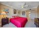 King bed, en-suite bathroom, and plenty of natural light in this bedroom at 17400 Gulf Blvd # I5, Redington Shores, FL 33708