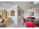 Bright dining area with a round table and red chairs at 17400 Gulf Blvd # I5, Redington Shores, FL 33708