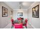 Dining room with round table and red chairs at 17400 Gulf Blvd # I5, Redington Shores, FL 33708