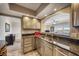 Modern stainless steel kitchen with granite countertops at 17400 Gulf Blvd # I5, Redington Shores, FL 33708