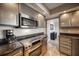 Modern stainless steel kitchen with granite countertops at 17400 Gulf Blvd # I5, Redington Shores, FL 33708