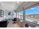 Home office with a desk, chair, and city views at 17400 Gulf Blvd # I5, Redington Shores, FL 33708