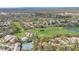 Aerial view of community with golf course and water features at 2222 Westchester Blvd, Spring Hill, FL 34606