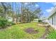 Private backyard with trees and a stone patio at 2222 Westchester Blvd, Spring Hill, FL 34606