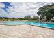 Large kidney shaped community pool with surrounding patio at 2361 Jamaican St # 15, Clearwater, FL 33763