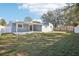 Home exterior showcasing a large backyard and patio at 2537 Martha Ln, Land O Lakes, FL 34639