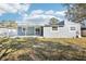House exterior with covered patio and fenced backyard at 2537 Martha Ln, Land O Lakes, FL 34639