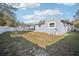 Large backyard with a view of the home's exterior at 2537 Martha Ln, Land O Lakes, FL 34639