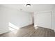 Spacious bedroom with double door closet and wood-look floors at 2537 Martha Ln, Land O Lakes, FL 34639