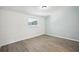 Simple bedroom with light walls and vinyl flooring at 2537 Martha Ln, Land O Lakes, FL 34639
