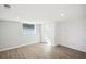 Simple bedroom with wood-look floors and window at 2537 Martha Ln, Land O Lakes, FL 34639