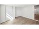 Bright bedroom with wood-look floors and closet at 2537 Martha Ln, Land O Lakes, FL 34639