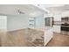 Modern kitchen with white cabinets and granite island at 2537 Martha Ln, Land O Lakes, FL 34639