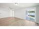 Living room with sliding glass doors and backyard access at 2537 Martha Ln, Land O Lakes, FL 34639