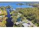 Wide aerial view of waterfront home and neighborhood at 2609 Meadowbrook Dr, Palm Harbor, FL 34684