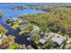 Wide aerial view of waterfront home and neighborhood at 2609 Meadowbrook Dr, Palm Harbor, FL 34684