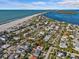 Aerial view showcasing the home's location near the beach and other homes at 35 Juniper Way, Clearwater Beach, FL 33767