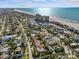 Aerial view showing the home's proximity to the beach and ocean at 35 Juniper Way, Clearwater Beach, FL 33767