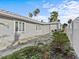 Charming home with a spacious backyard patio, perfect for outdoor entertaining at 35 Juniper Way, Clearwater Beach, FL 33767