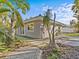 Side view showcasing unique landscaping and architecture at 35 Juniper Way, Clearwater Beach, FL 33767