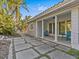 Front porch with columns, and teal chairs at 35 Juniper Way, Clearwater Beach, FL 33767