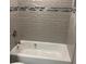Clean and modern bathroom with a shower/tub combo and tile surround at 3631 4Th N Ave, St Petersburg, FL 33713