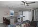 Open concept kitchen and living area with updated appliances, granite counters, and breakfast bar at 3631 4Th N Ave, St Petersburg, FL 33713