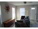 Cozy living room with decorative wall art, couch, and lots of natural lighting at 3631 4Th N Ave, St Petersburg, FL 33713