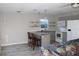 Modern kitchen with gray cabinets, granite countertops, and open shelving at 3631 4Th N Ave, St Petersburg, FL 33713