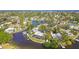 Aerial view of waterfront home with private dock and lush landscaping at 4780 Butterfly Ne Pl, St Petersburg, FL 33703
