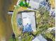 Aerial view of a home with a pool and private dock at 4780 Butterfly Ne Pl, St Petersburg, FL 33703