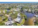 Aerial view of a waterfront home nestled in a quiet residential community at 4780 Butterfly Ne Pl, St Petersburg, FL 33703