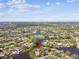 Wide aerial view showcasing the property's waterfront setting and neighborhood at 4780 Butterfly Ne Pl, St Petersburg, FL 33703
