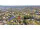 Property shown in an aerial view, highlighting its canal-front location at 4780 Butterfly Ne Pl, St Petersburg, FL 33703