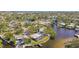 Aerial view showing home's location on a canal with neighborhood context at 4780 Butterfly Ne Pl, St Petersburg, FL 33703