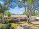 Ranch style home with mature landscaping and a large yard at 4780 Butterfly Ne Pl, St Petersburg, FL 33703