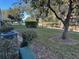 Private backyard with grassy area, trees and AC unit at 8220 112Th St # 103, Seminole, FL 33772