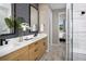 Modern bathroom with double vanity and walk-in shower at 11286 Boundless Ter, Venice, FL 34293