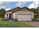 One-story home with a two-car garage and attractive landscaping at 11286 Boundless Ter, Venice, FL 34293