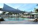 Resort-style pool with shaded seating and lounge chairs at 11294 Boundless Ter, Venice, FL 34293